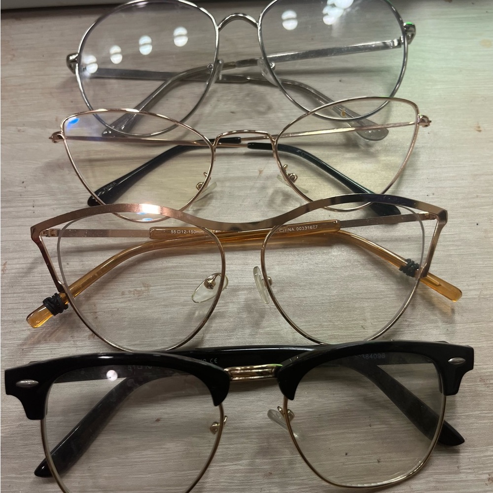 Stylish Eyeglasses Set in Black, Gold, and Silver
